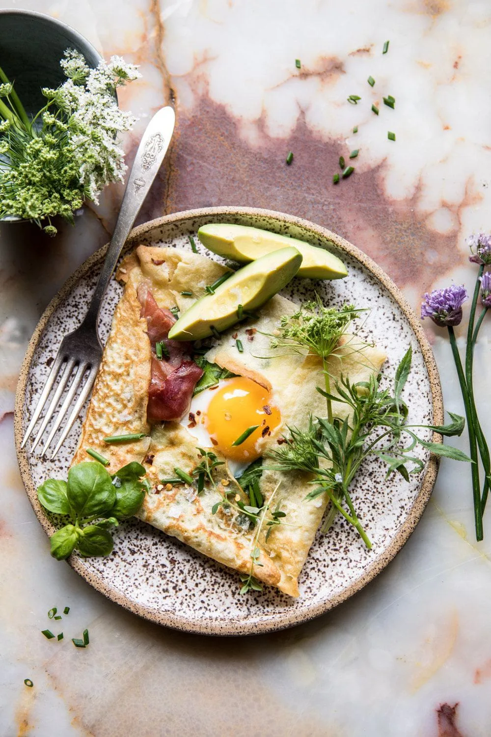 cheesy-baked-egg-crepes-with-spring-herbs-and-avocado