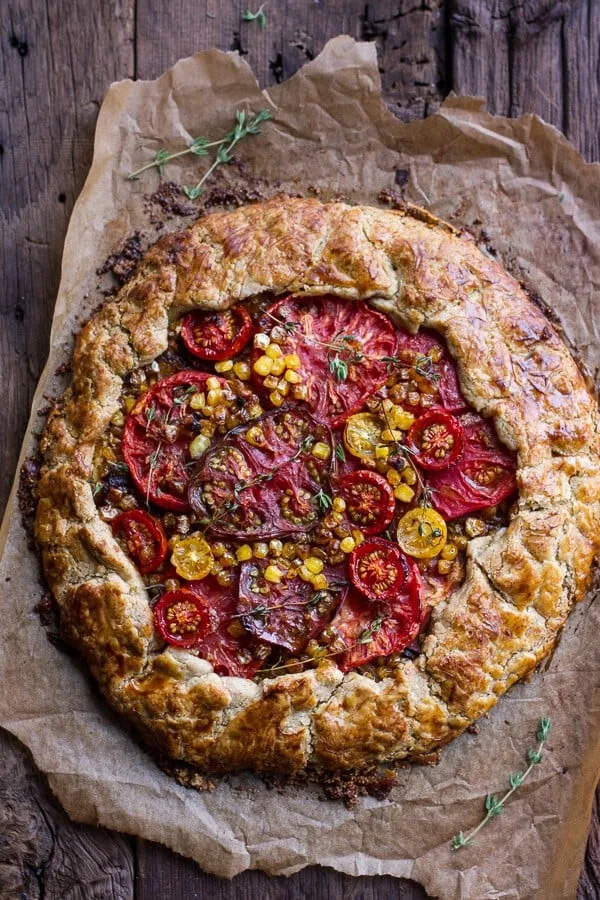 caramelized-corn-and-heirloom-tomato-galette-wherbed-roasted-garlic-goat-cheese.