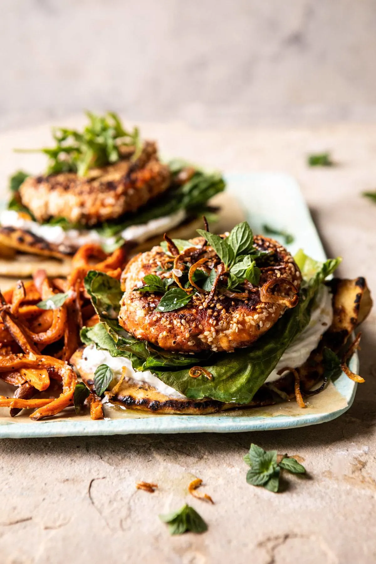 sesame-crusted-curried-salmon-burgers-with-lemony-herbs.