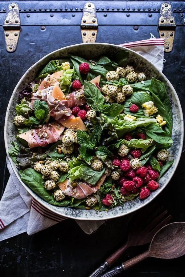 fresh-basil-salad-with-prosciutto-wrapped-melon-and-toasted-seed-rolled-goat-cheese