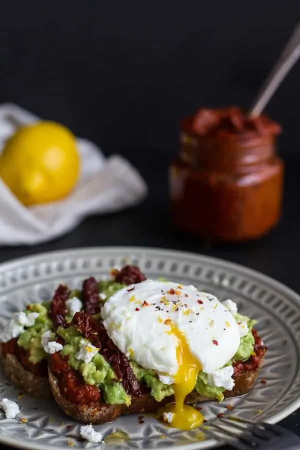harissa-smashed-avocado-egg-toast-with-goat-cheese-and-honey-drizzle.