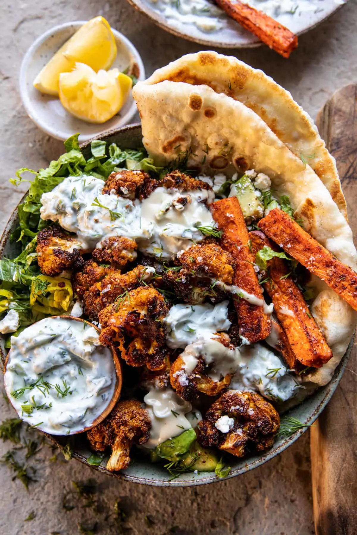 crispy-cauliflower-tzatziki-bowls-with-sweet-potato-fries