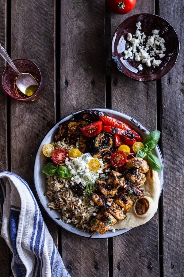 greek-chicken-souvlaki-and-rice-pilaf-plates-wmarinated-veggies-feta-tzatziki.
