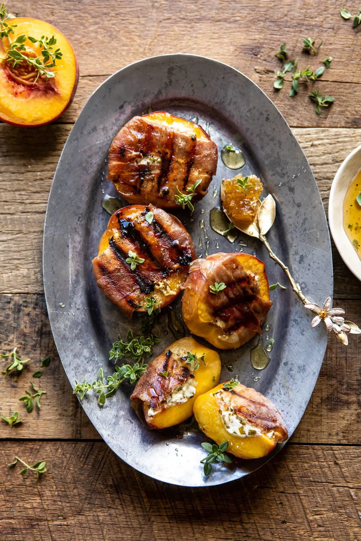 prosciutto-goat-cheese-stuffed-peaches-with-thyme-honey.