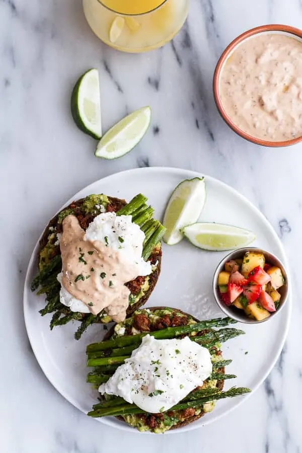 cotija-guacamole-chorizo-eggs-benedict-with-honey-chipotle-lime-sauce.