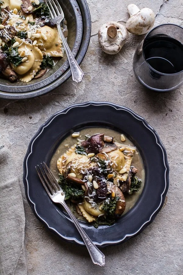 taleggio-ravioli-with-garlicy-butter-kale-and-mushroom-sauce-toasted-pine-nuts