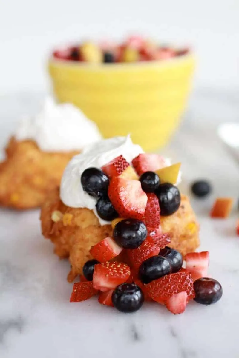 corn-fritters-with-coconut-whipped-cream-and-sweet-honey-bourbon-syrup