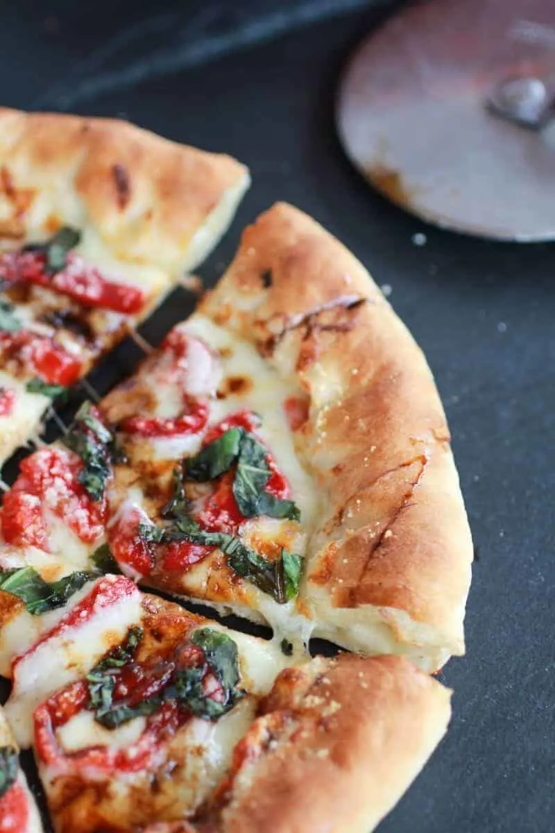 green-olive-pesto-pizza-with-feta-stuffed-crust-roasted-red-peppers-and-balsamic-drizzle