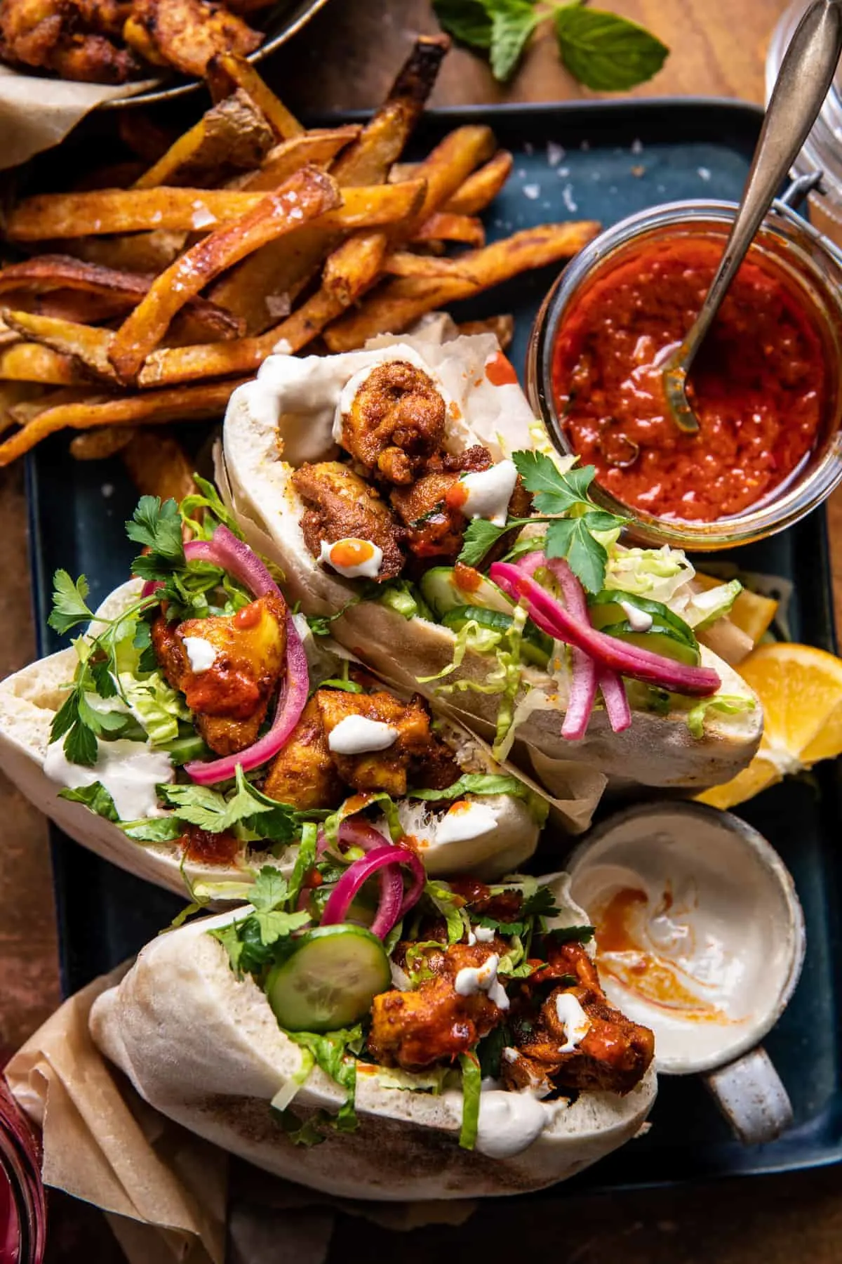 roasted-turmeric-chicken-pitas-with-garlic-lemon-tahini