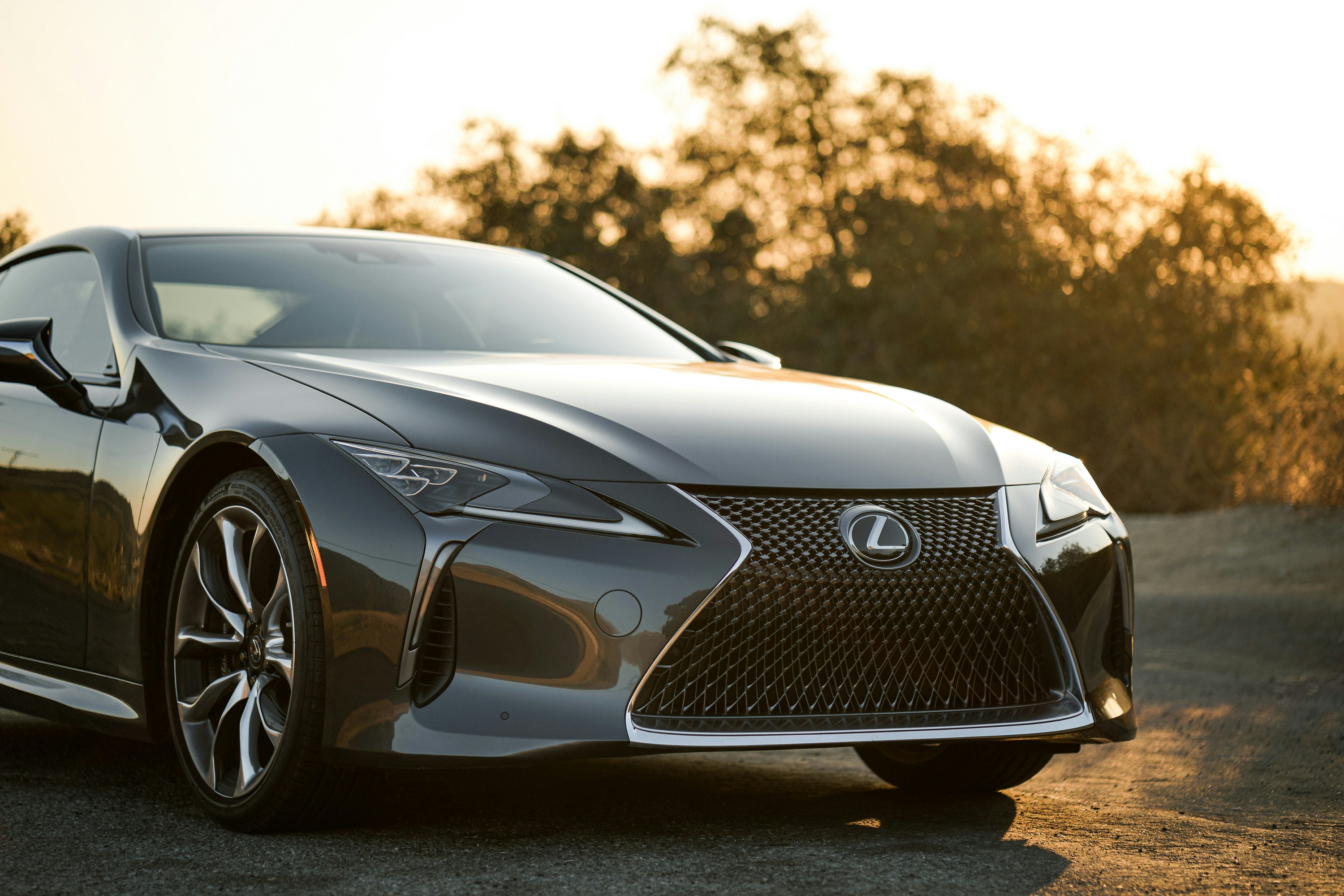 parked grey Lexus in the sun