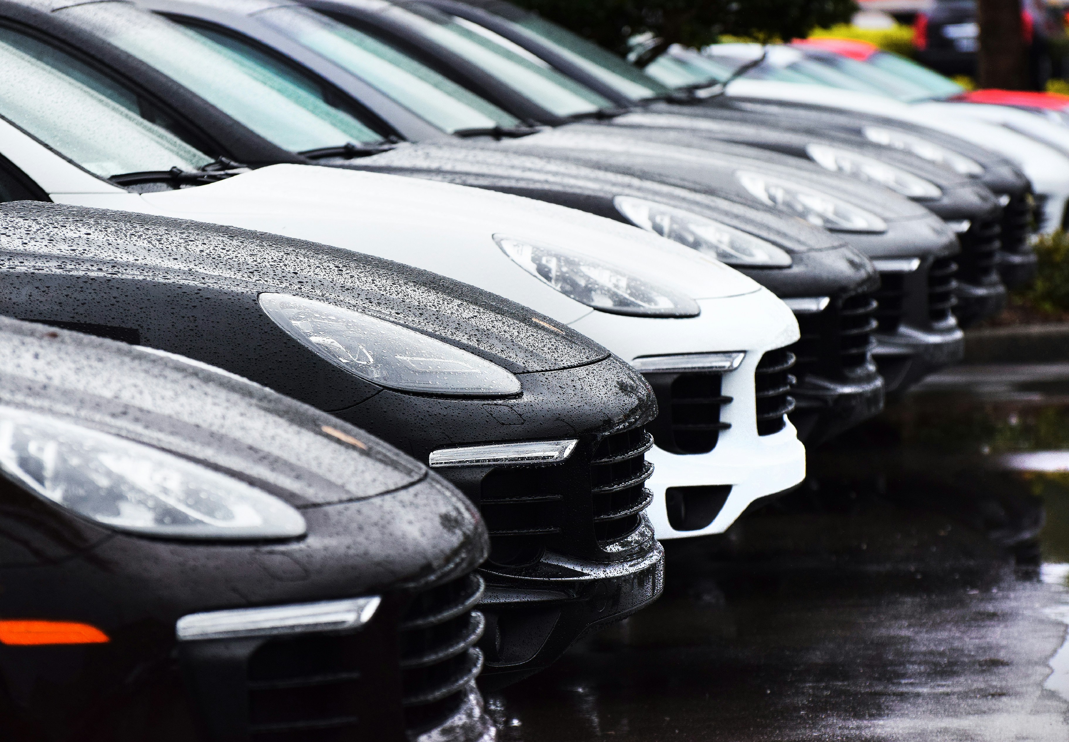 a row of cars in the rain
