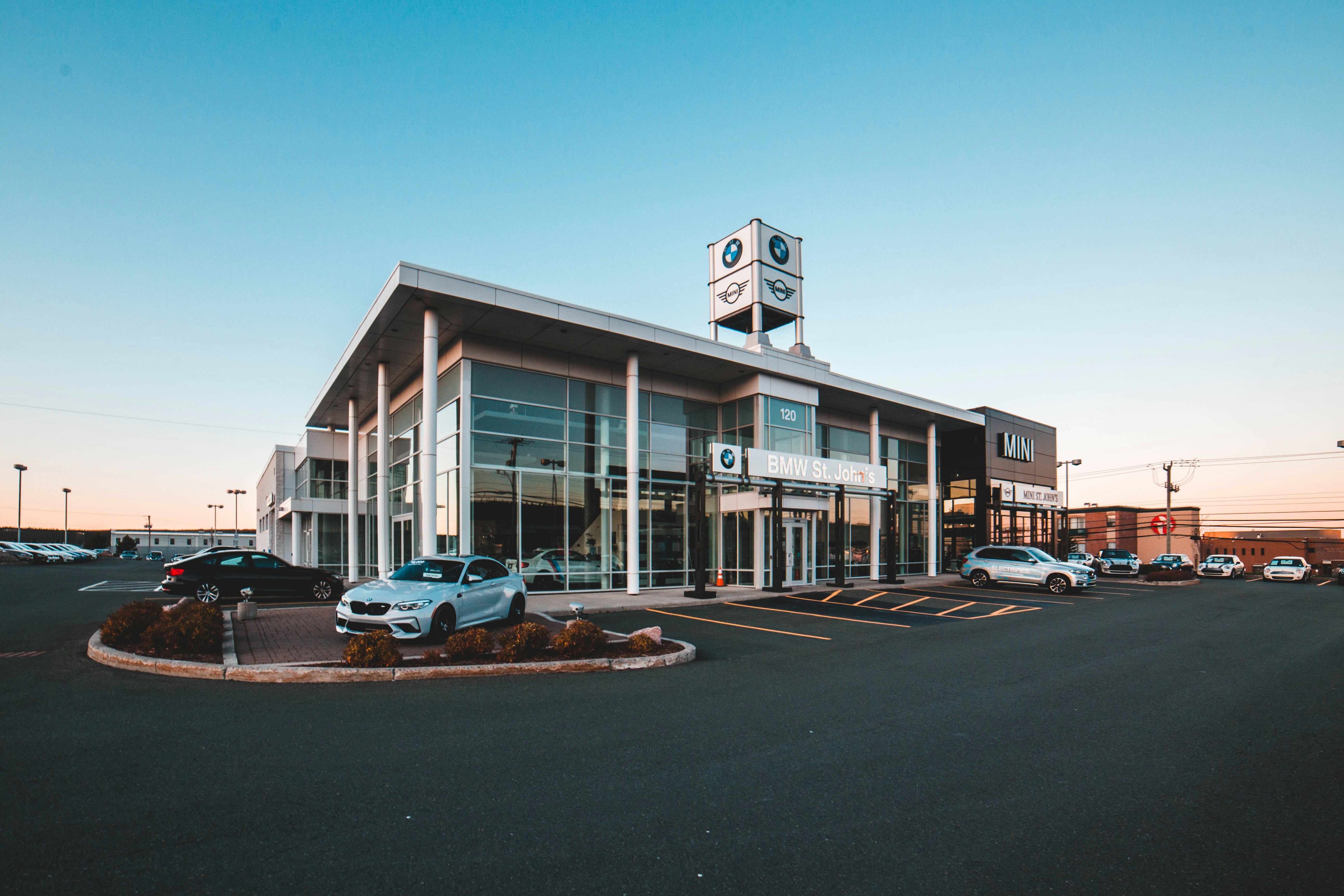 A BMW dealership at sunset