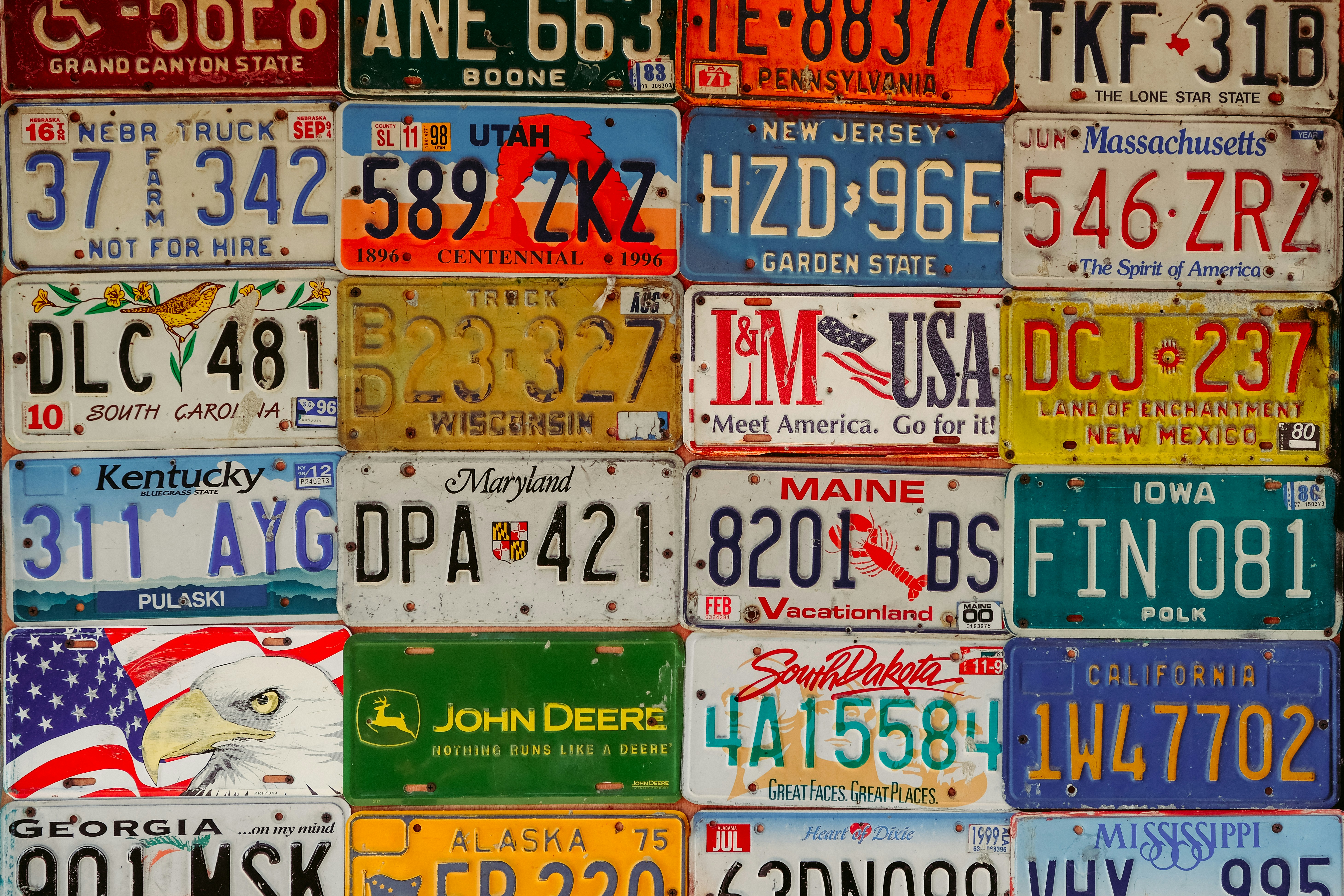 Colorful rows of license plates from many different states