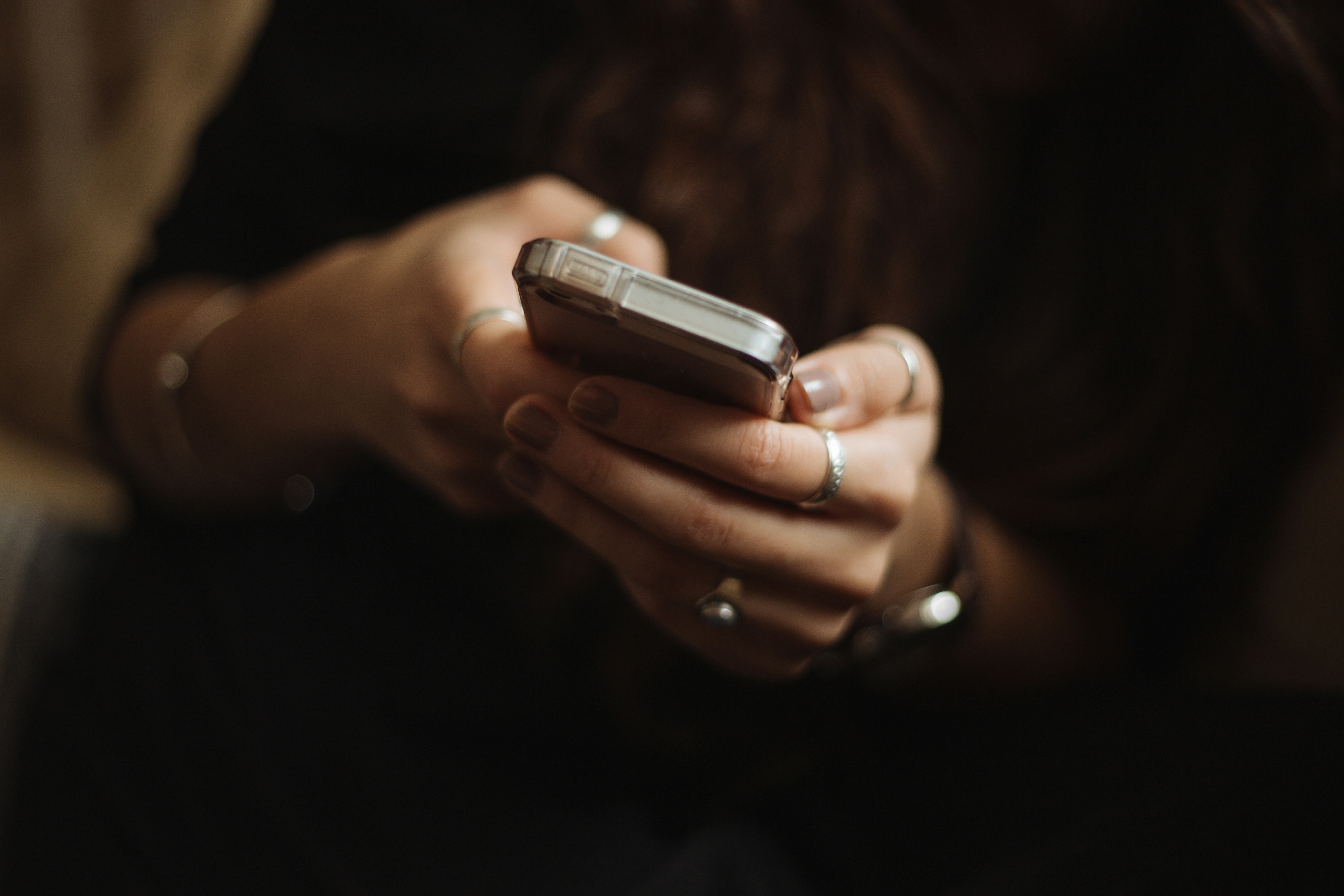 Woman's hands holding a smart phone