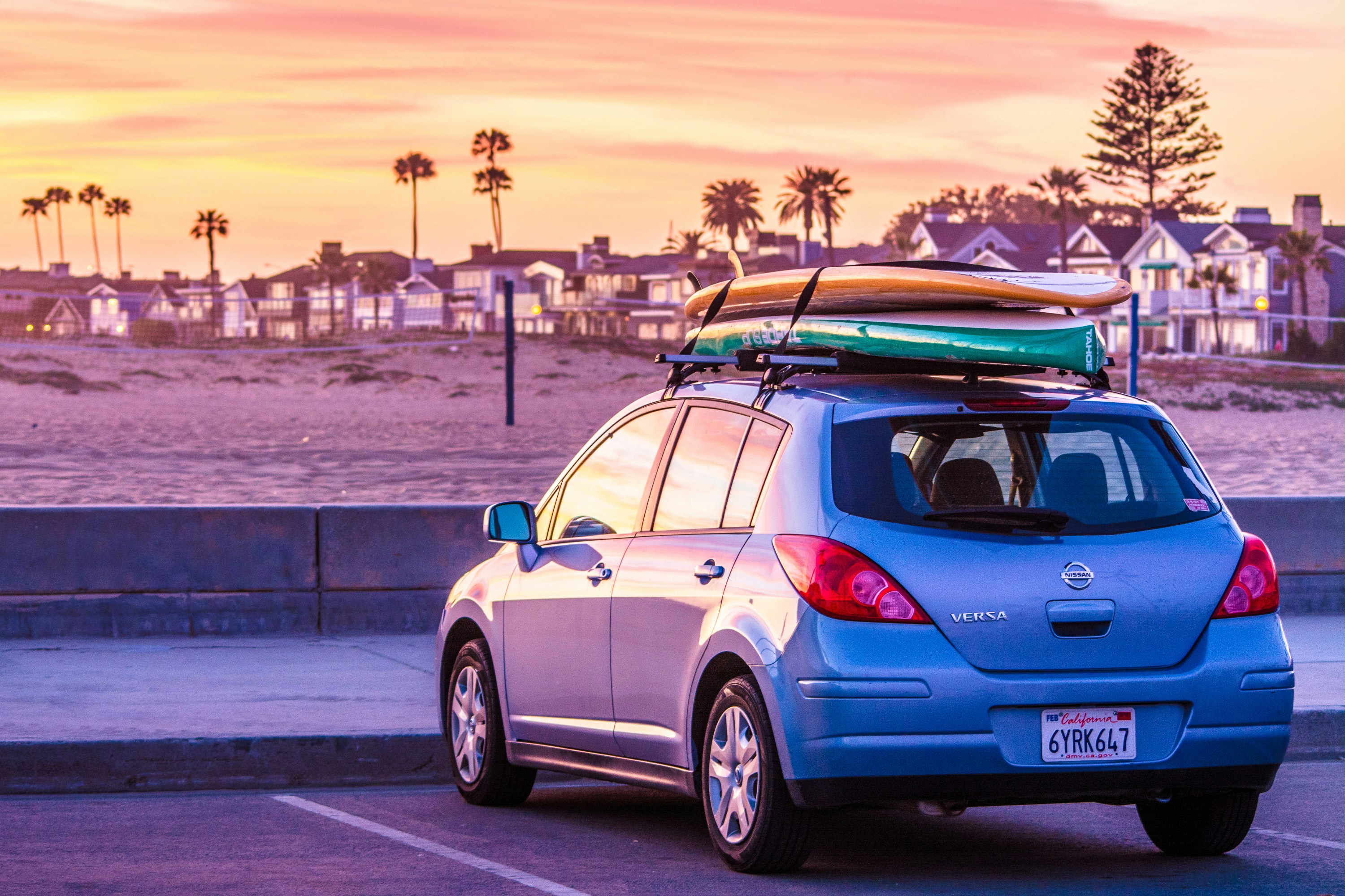Car at beach with surf boards on top