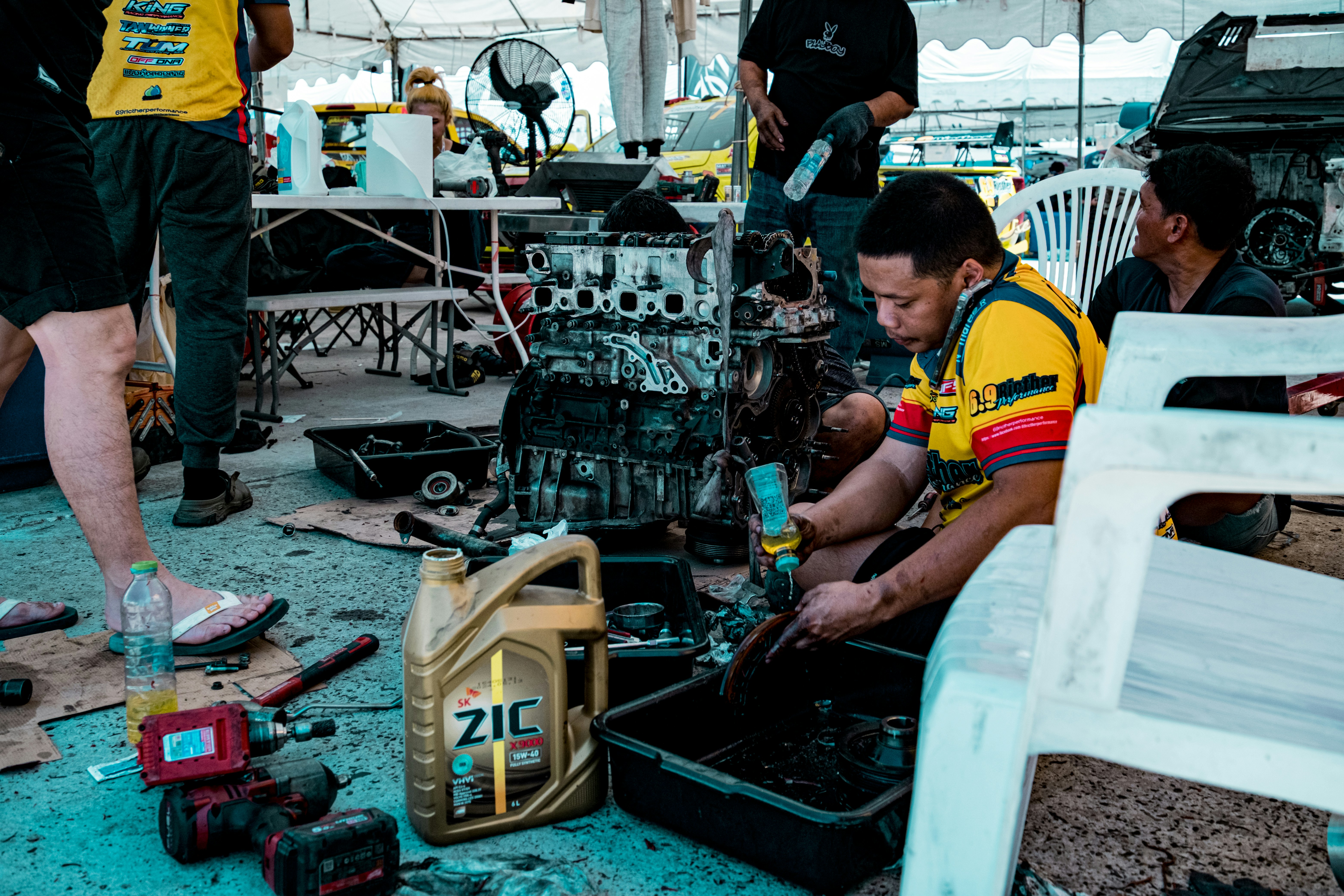 Race car team working on engine parts