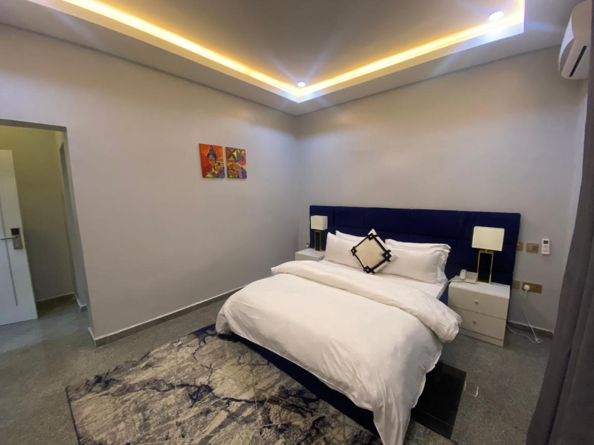 Luxurious bedroom with warm lighting and elegant furnishings