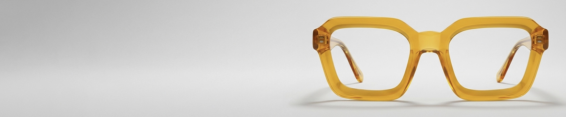 Square-shaped glasses with translucent olive green frames on a pale green background.