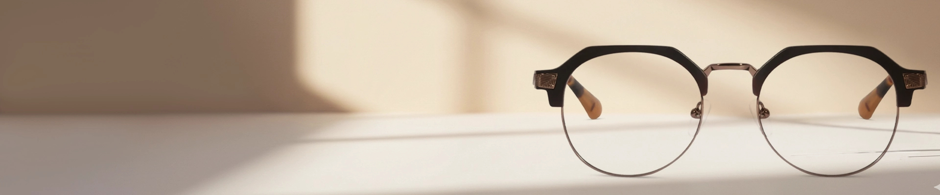 Stylish browline glasses with prominent black acetate upper rims and slim silver metal lower rims, displayed on a pale blue background. The image is paired with promotional text for Browline Glasses, including a special offer and an Excellent Trustpilot rating.