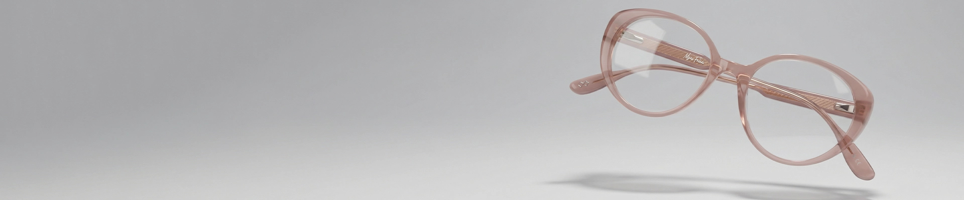 Bold amber-coloured oval eyeglasses with thick round rims, displayed on a clean white background