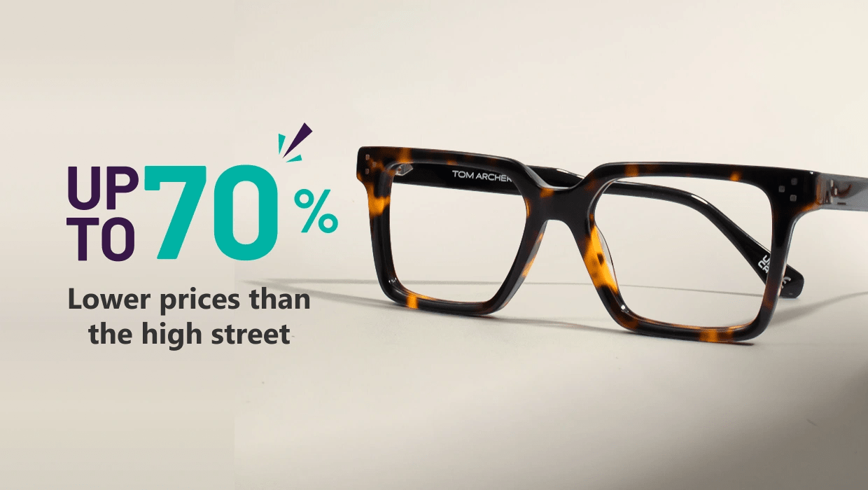 Banner highlighting ‘Eyewear At 70% Off, Less Cost Than High Street’ with large blue text and a pair of geometric blue-rimmed Specscart glasses on the right side, set against a simple pale backdrop.