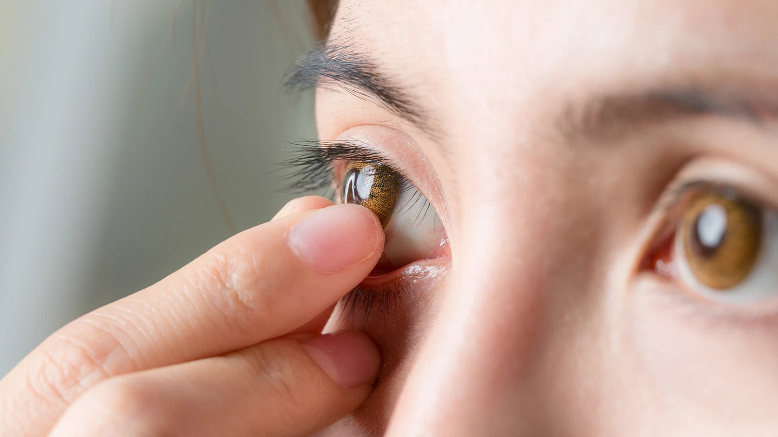Remove contact lenses from your eyes