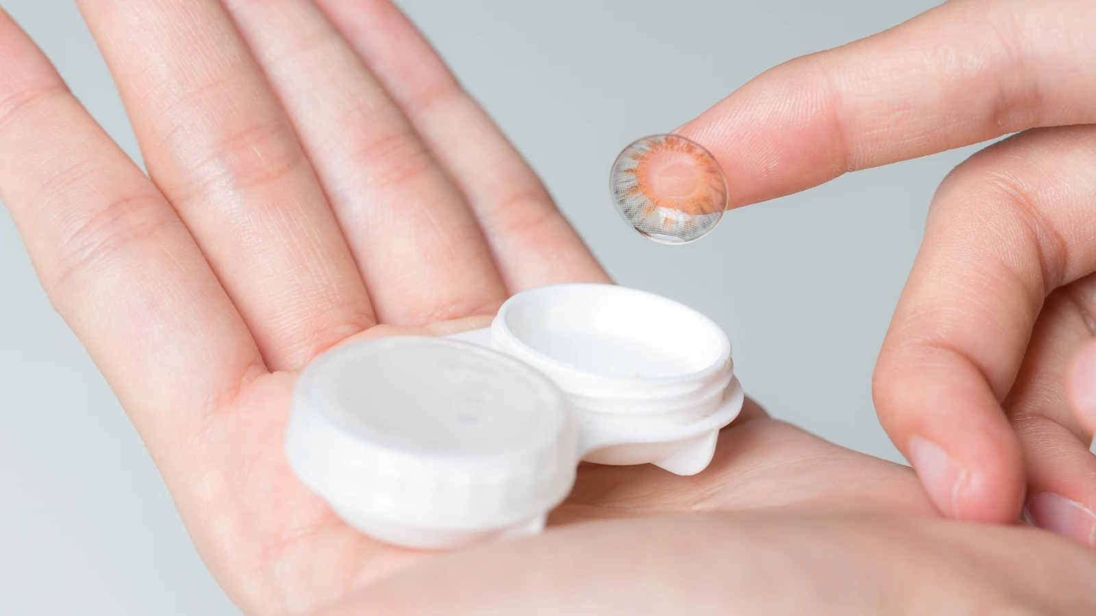 Take out the lens from the storage case: One lens at a time