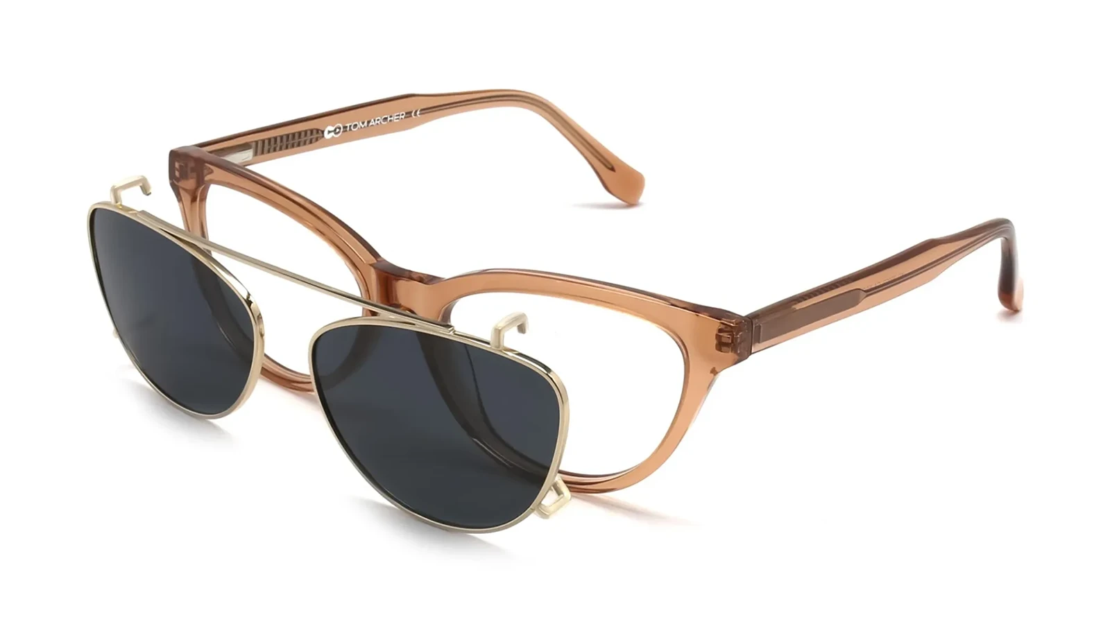 A pair of brown acetate eyeglass frames with a detachable gold metal clip-on featuring dark tinted lenses, designed to instantly transform prescription glasses into functional sunglasses.