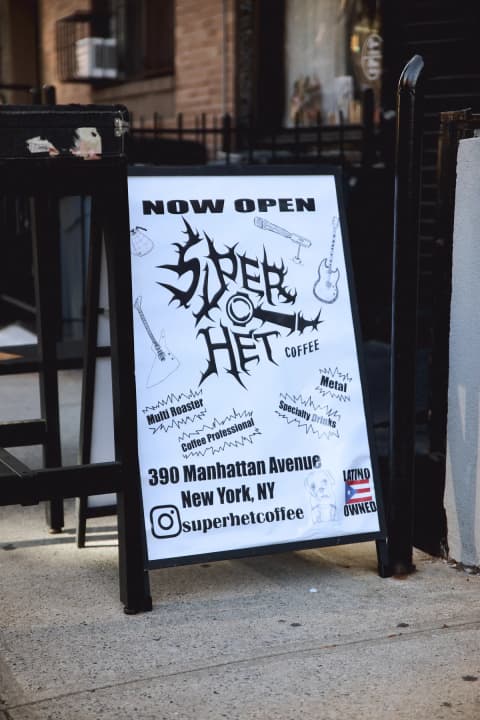 SuperHet Coffee sidewalk sign in West Harlem