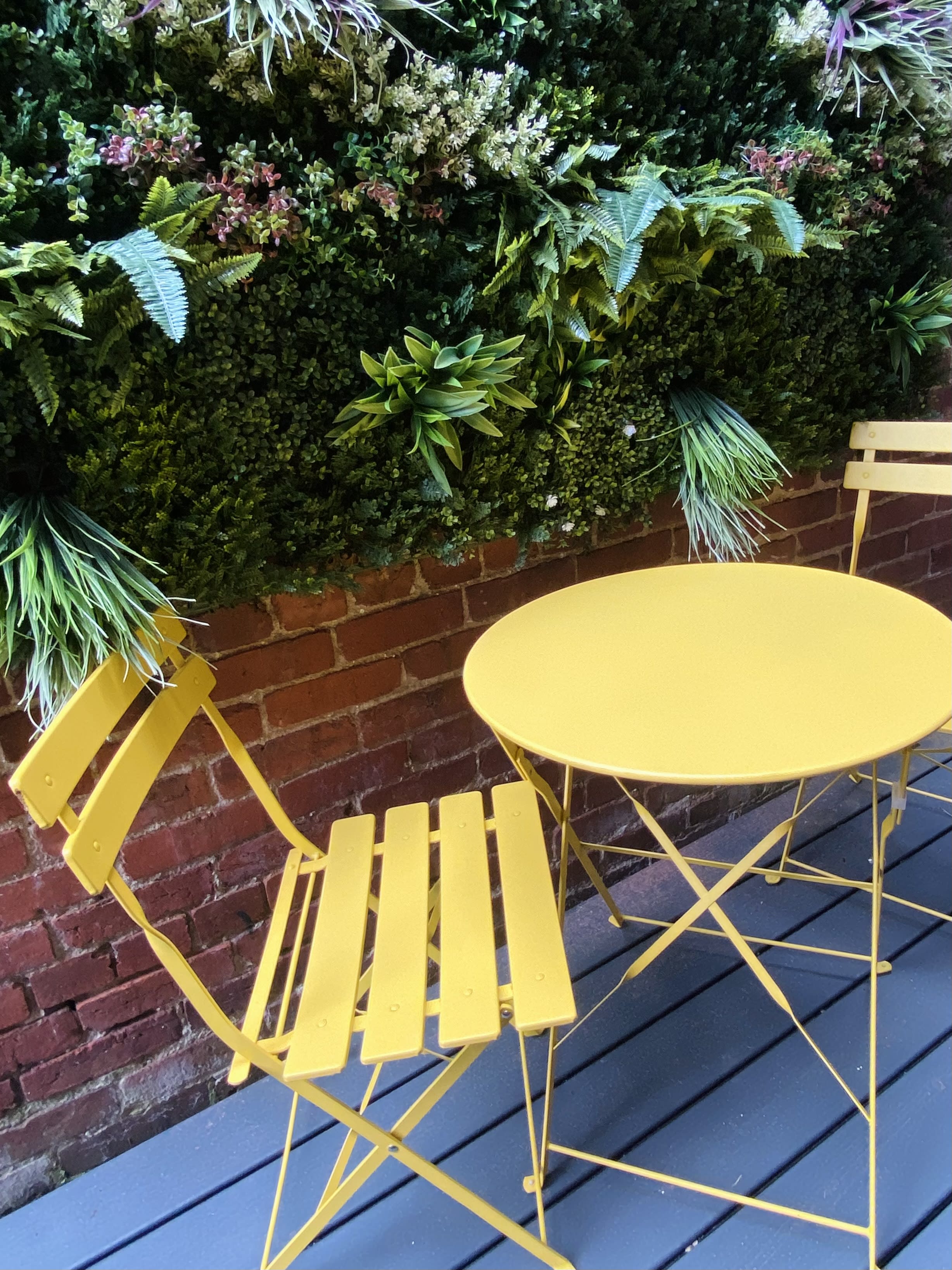 Yellow bistro table and chairs on the deck