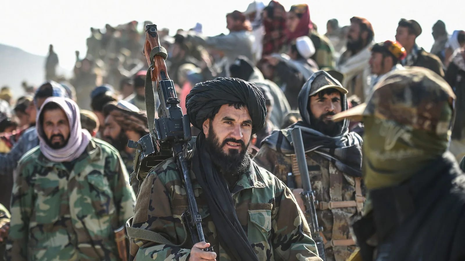 Indian and Taliban flags displayed during a celebration event.