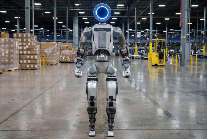 A futuristic robot performing on stage during a show.