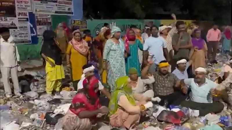 Sanitation workers in Haryana resuming their duties in a city.