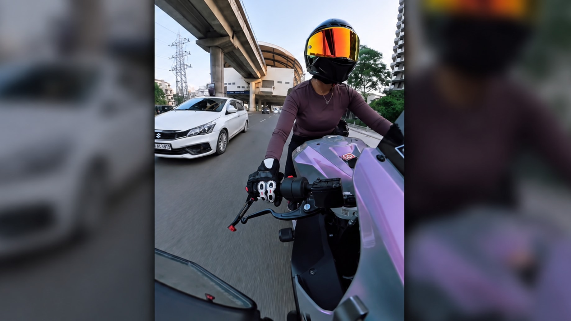 A busy street in Gurugram with pedestrians and vehicles.