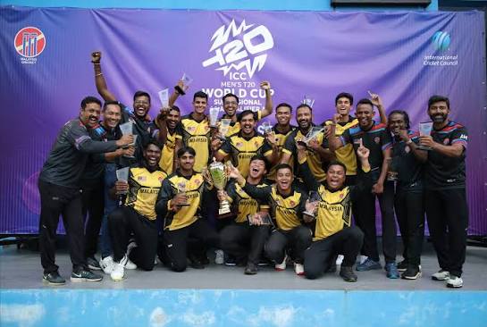 Cricket stadium in Malaysia filled with enthusiastic fans.