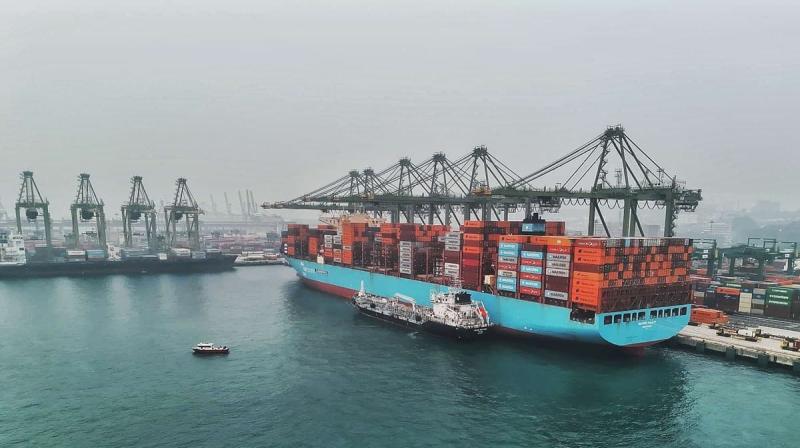 A large ship being bunkered with ethanol fuel at a Singapore port.