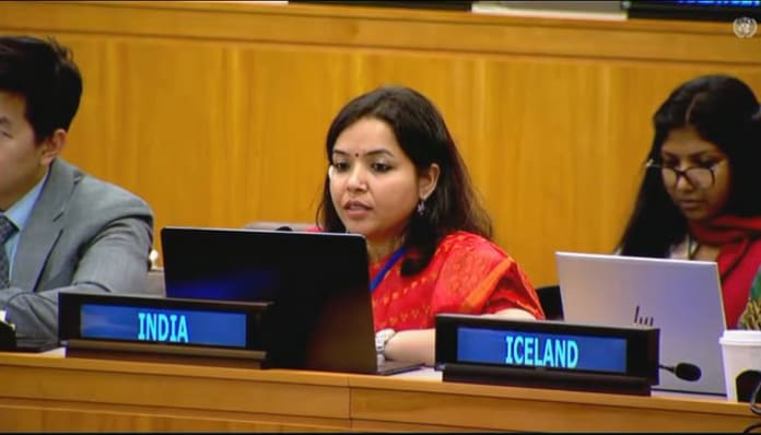 A meeting room at the United Nations with representatives discussing democracy.