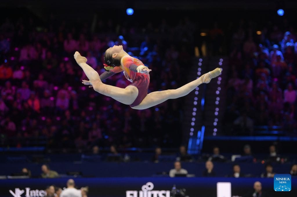 Chinese women's gymnastics team celebrating their gold medal victory