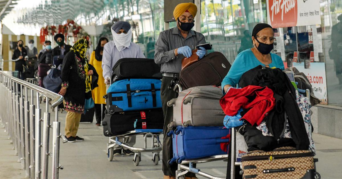 A person traveling with a backpack, showcasing budget travel options amid a changing landscape.