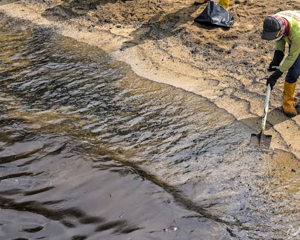 Cleanup crew working on an oil spill at East Coast Park in Singapore.