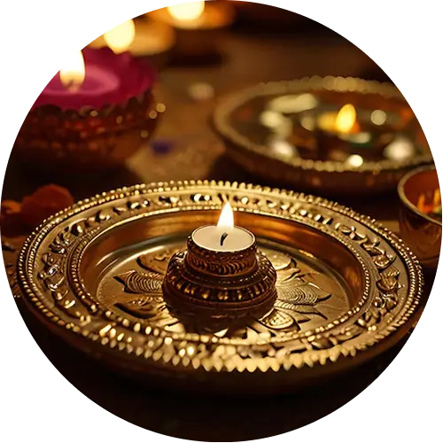 Puja thali with a lit diya
