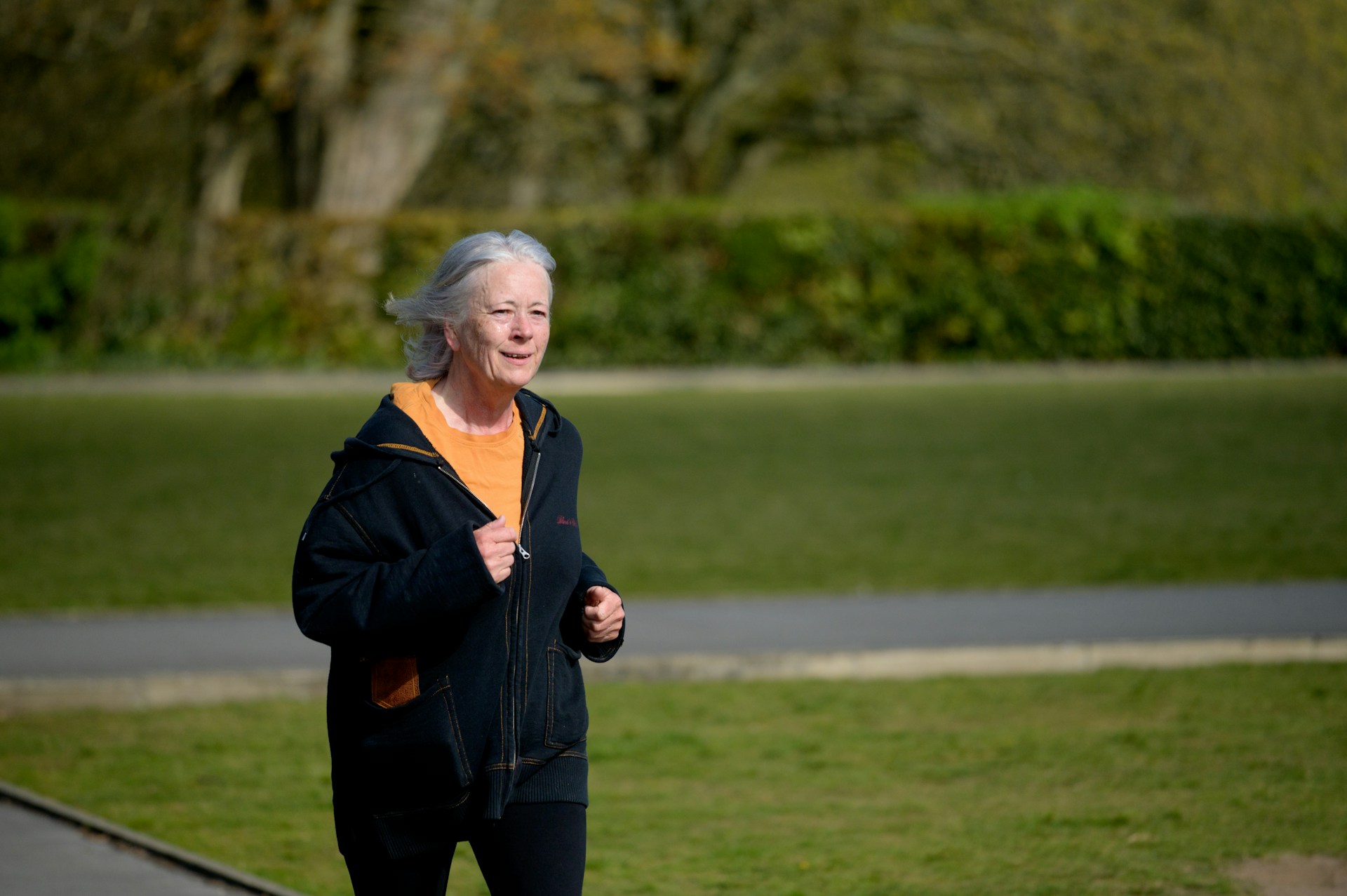 Image of old lady running