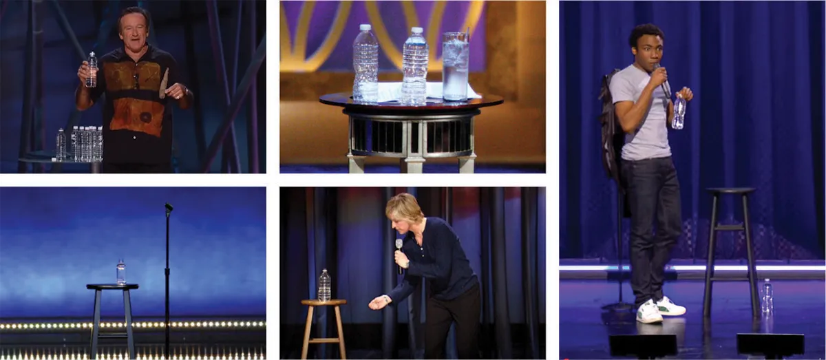 Stand-up comedians holding water bottles