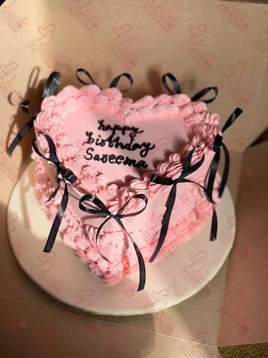 Pink Black Heartshape Ribbon Cake in Rawalpindi