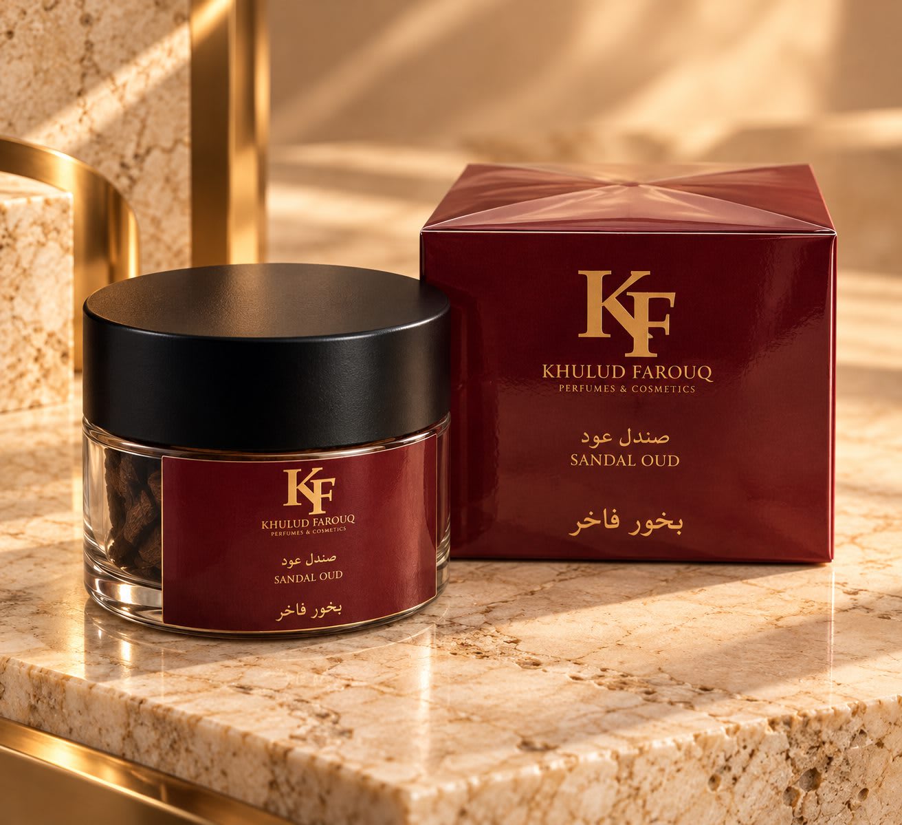 Sandal Oud bakhoor jar beside its burgundy box on a golden marble ledge
