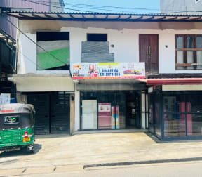 Land For Sale with house and shops