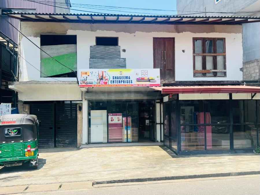 Land For Sale with house and shops