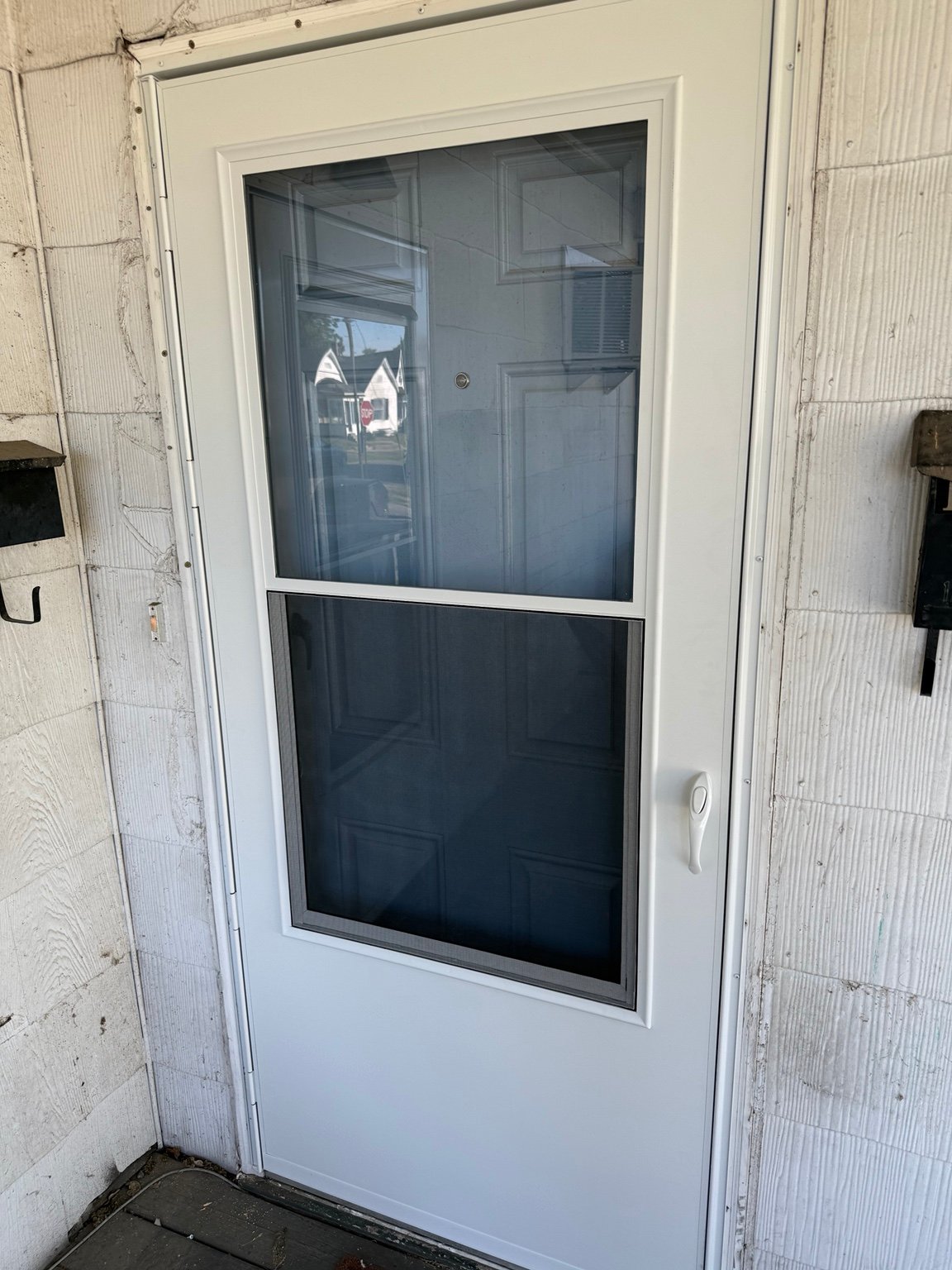 Newly installed six-panel interior wood door with clean trim