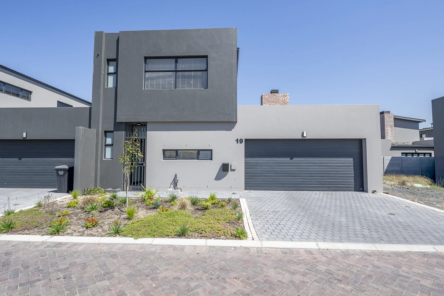 Greystone exterior with garden