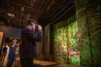 Person using VR glasses during Becoming Jane exhibition